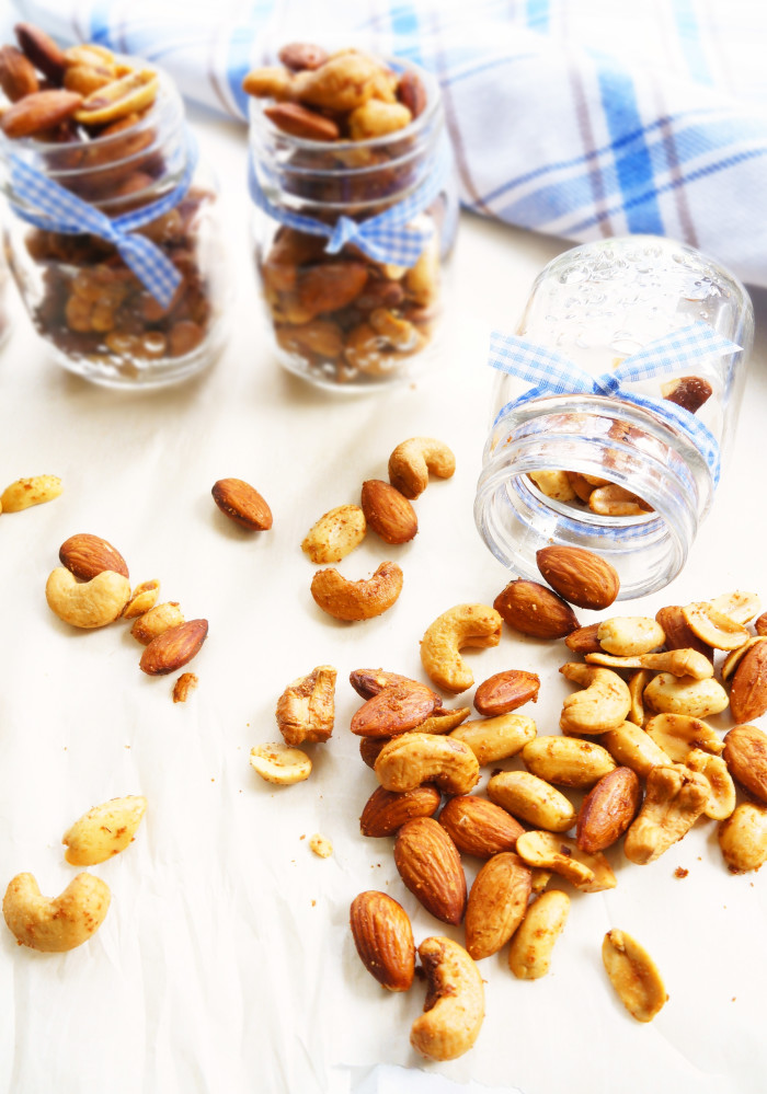 Tipped mason jar with nuts spilling out