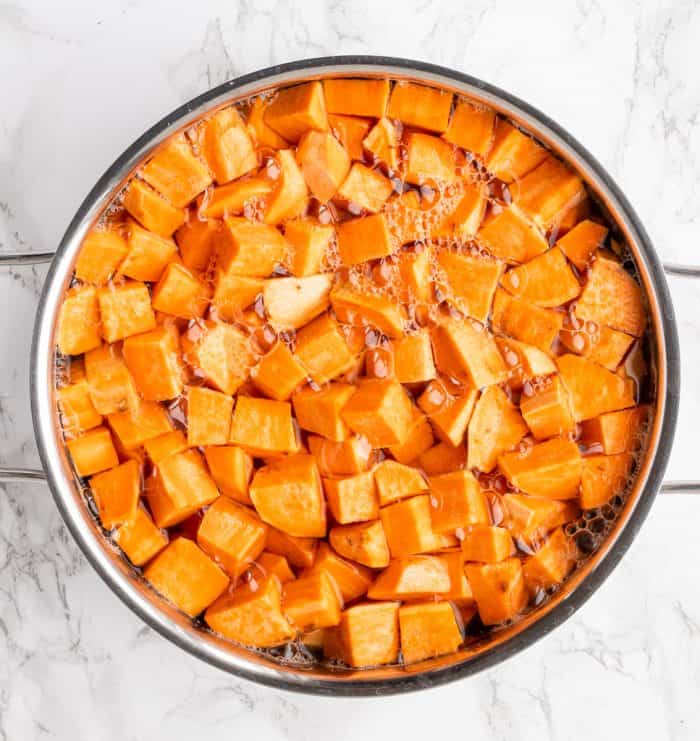 Cubes of sweet potato in a pot of water