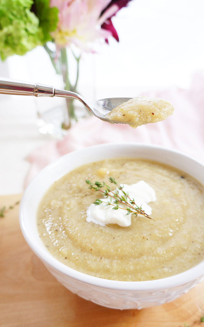 Low carb creamy cauliflower soup on a spoon