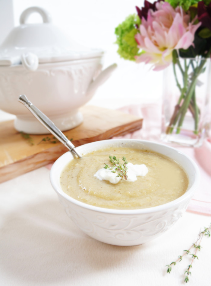 Low carb creamy cauliflower soup in a white bowl