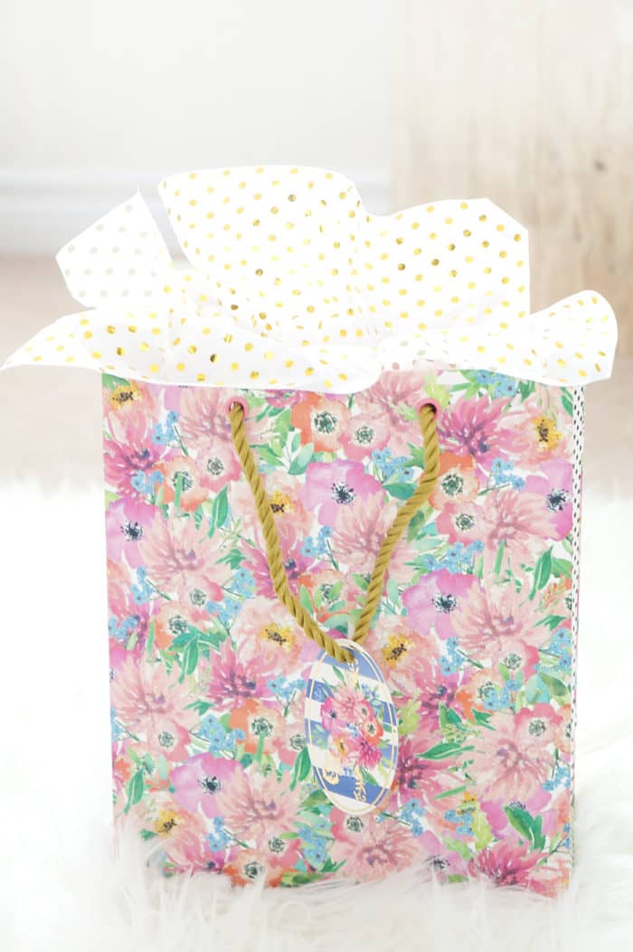 Floral gift bag with gold-spotted tissue paper