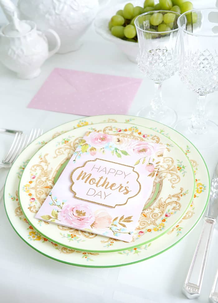 Mother\'s Day card on a decorated plate on top of a larger decorated plate