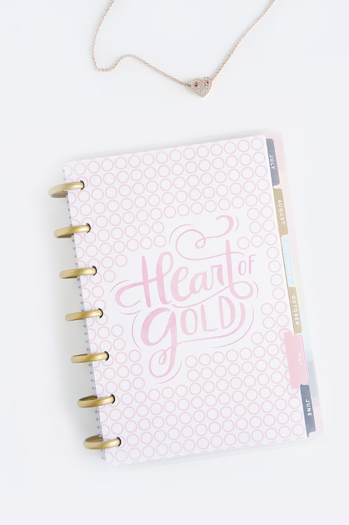 Spiral planner with a cover that reads \"Heart of Gold\"