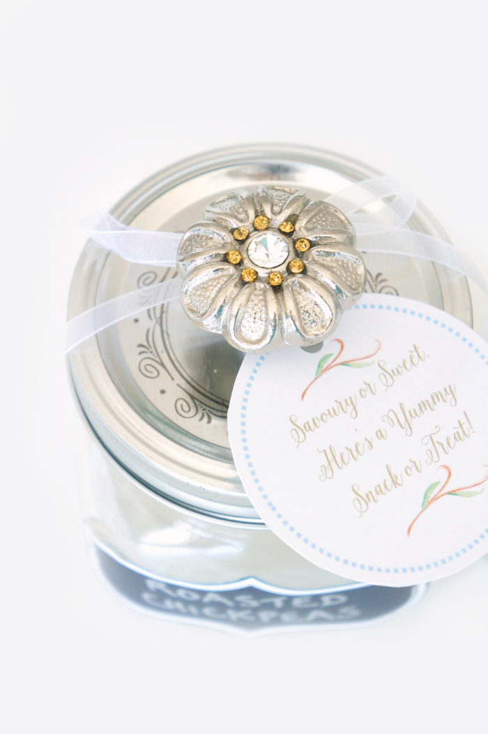 Mason jar lid with decorative knob attached with a tag that reads \"Savory or Sweet Here\'s a Yummy Snack or Treat\"