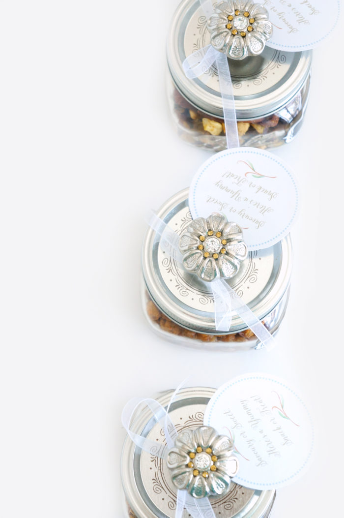 Overhead shot of mason jars with decorative knobs on the tops