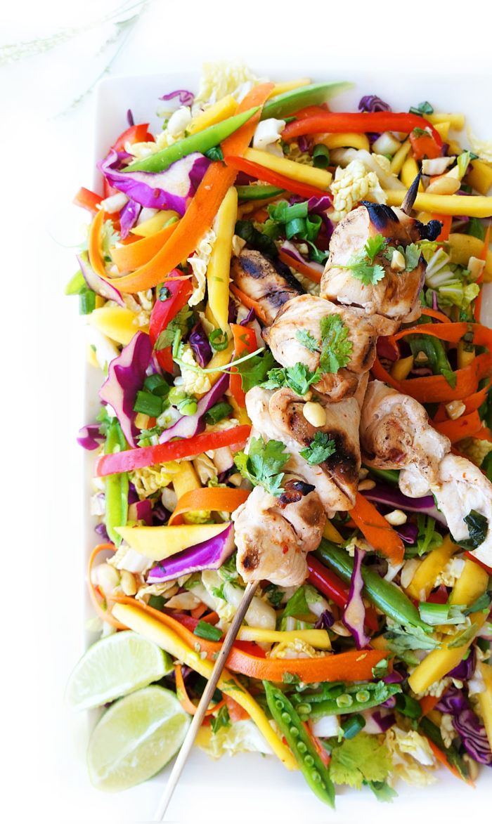 Overhead shot of Rainbow Detox Salad with Asian Chicken Skewers