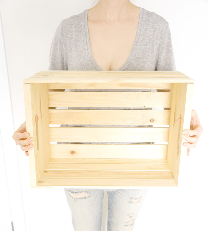 Woman holding a Wooden Crate