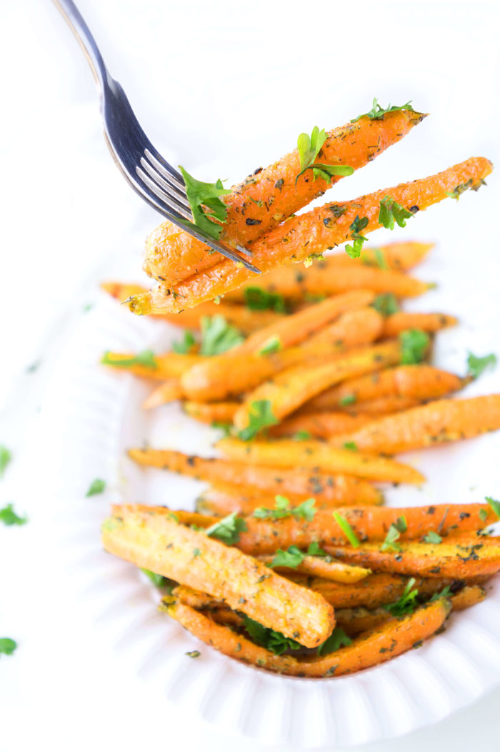 Fork grabbing two Roasted Ranch Carrots