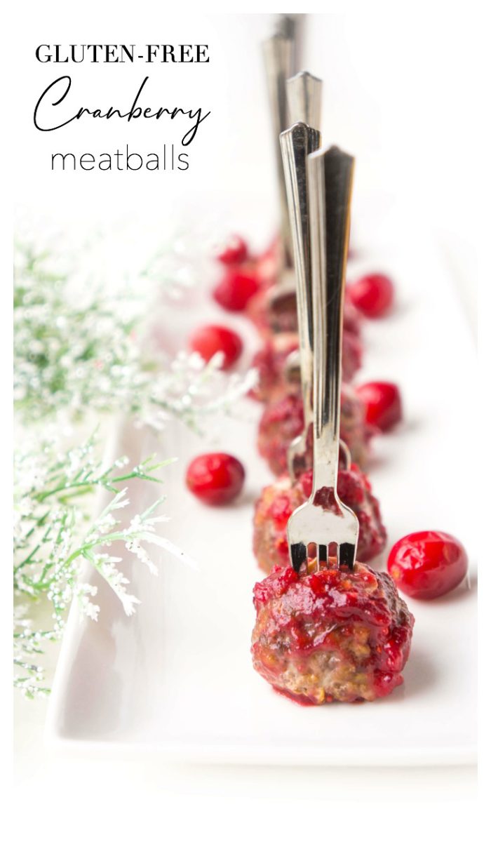 Line of Cranberry Meatballs with forks in them
