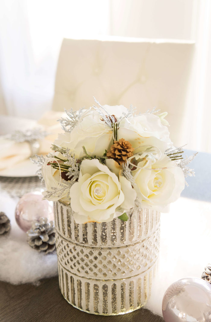 White flowers in a textured silver vase
