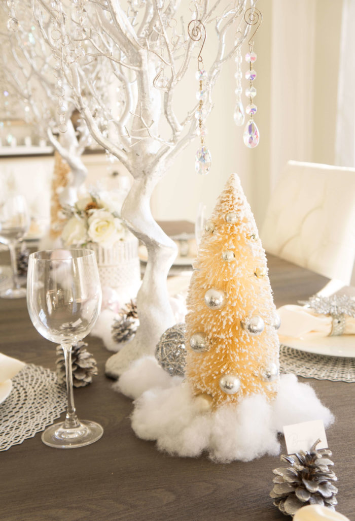 Ivory bottle brush Christmas tree set on a table