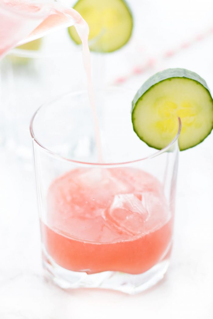 Pitcher pouring Watermelon Cucumber Spritzer into a glass