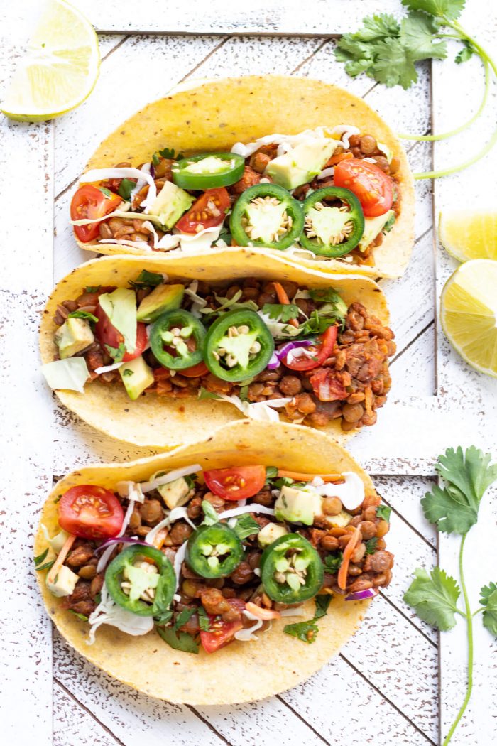 Overheard shot of three assembled Vegan Lentil Tacos