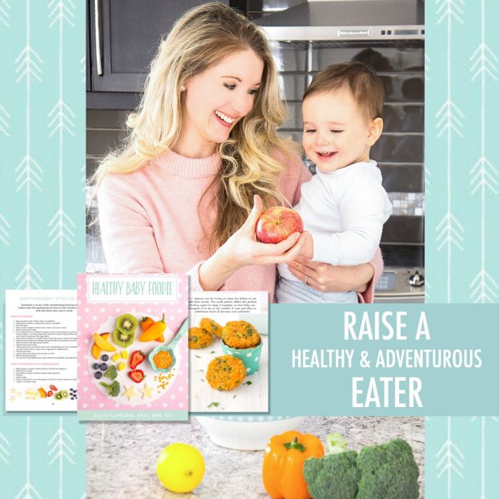 Elysia holding a baby and offering him an apple with the text \"Raise a Healthy & Adventurous Eater\"