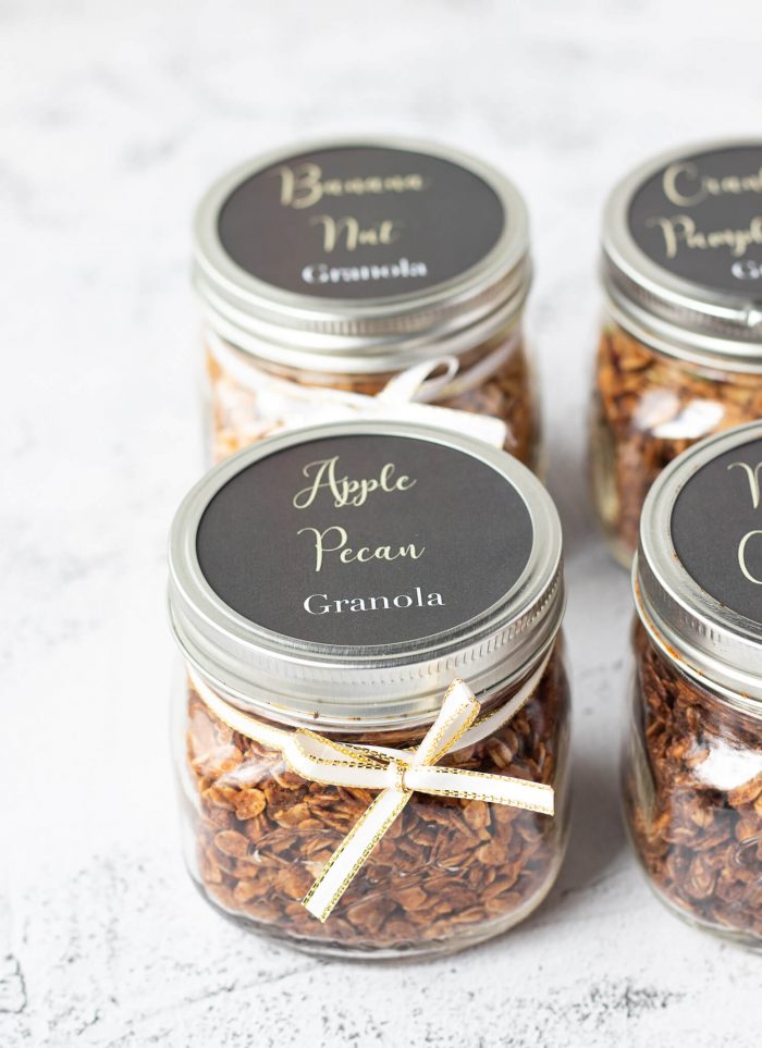 Four labeled jars of granola