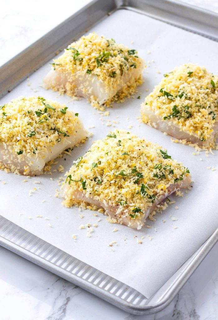parmesan crusted cod on baking sheet before cooking