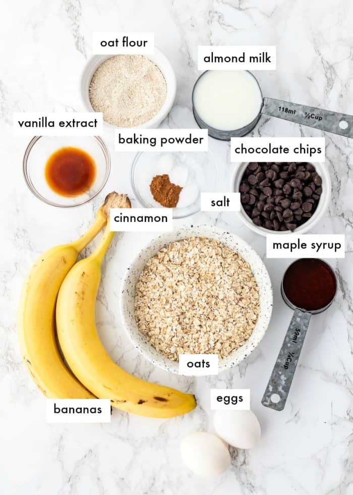 ingredients for oatmeal breakfast bars on a marble background with labels