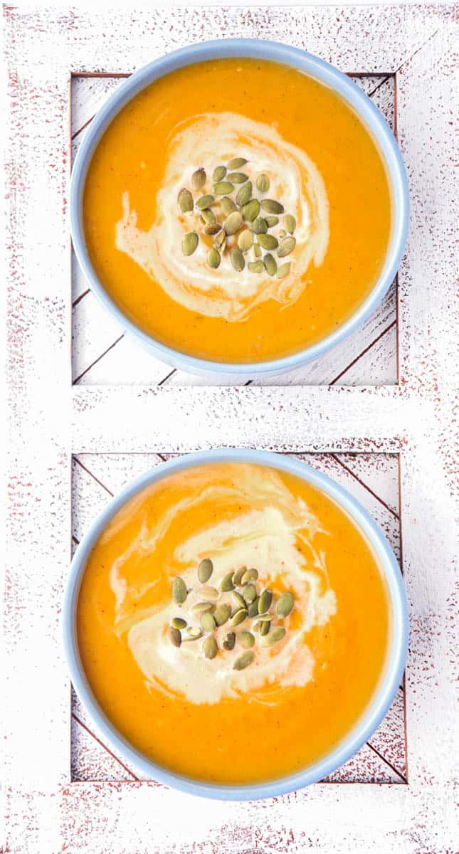 Two bowls of orange soup next to each other on placemats.