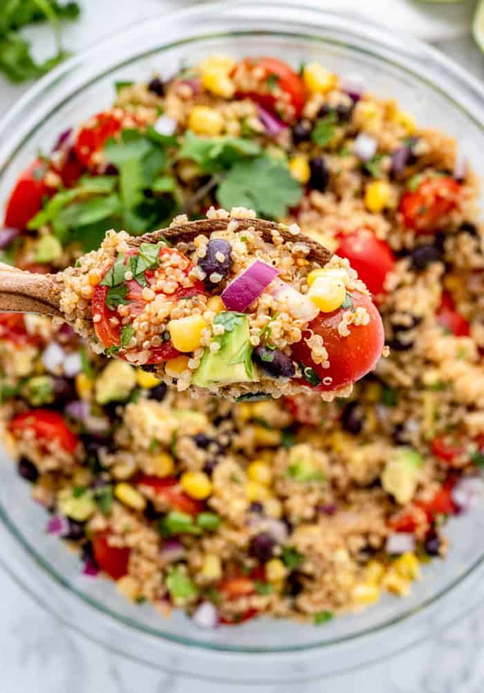Quinoa salad on a spoon.