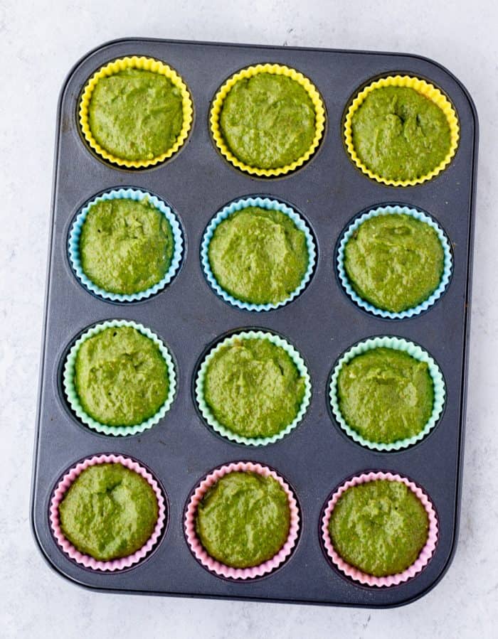 Muffin molds filled with the batter.