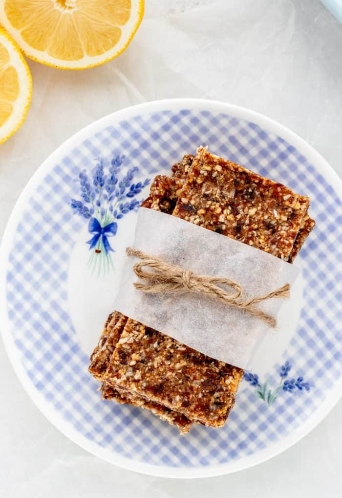The vegan lemon bars wrapped in a strip of parchment and tied with string.