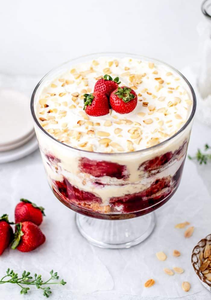 Side view of the trifle topped with strawberries and toasted almonds