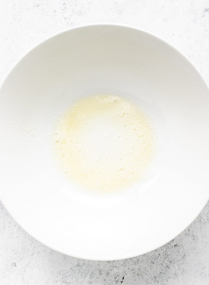 egg white in a large bowl.