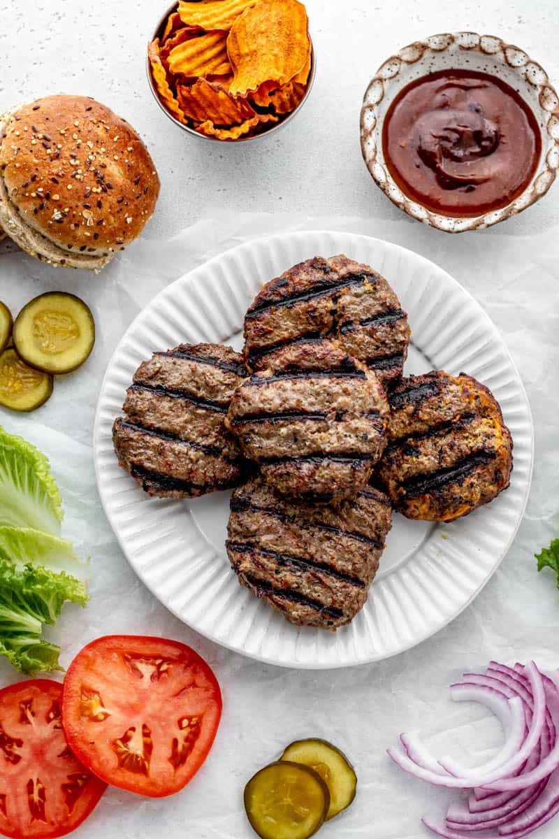 Grilled Worcestershire sauce burgers on a serving plate.