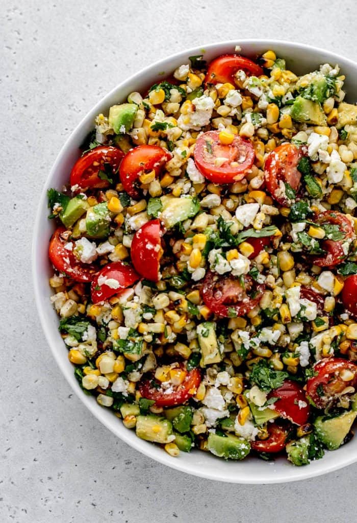 Overhead shot of grilled corn salad in a bowl.