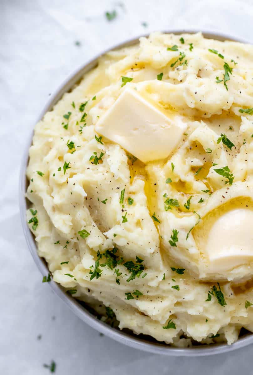 An up close overhead image of mashed potatoes in a bowl.