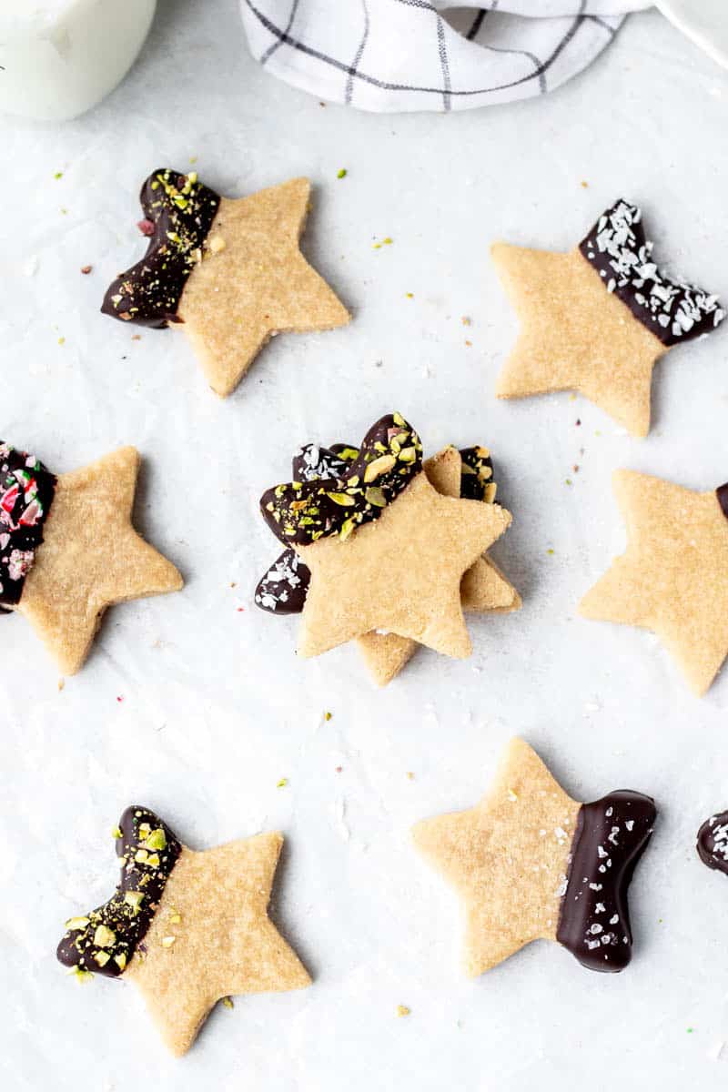 Chocolate dipped 3-ingredient almond flour cookies, sprinkled with pistachios, sea salt, coconut or crushed candy canes.
