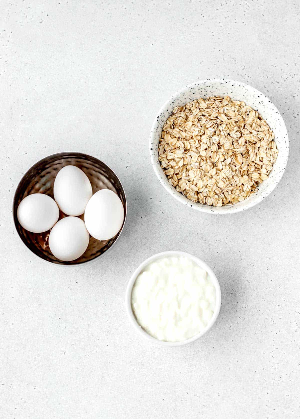 Ingredients for 3 ingredient protein waffles, including 4 eggs, cottage cheese and rolled oats.