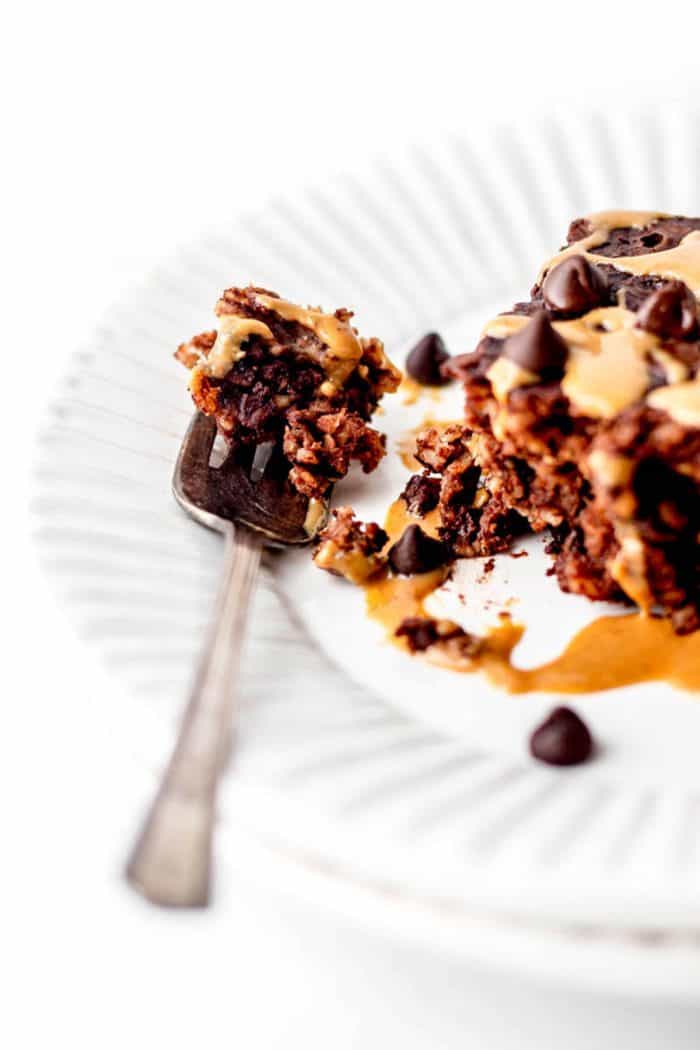 A fork with some chocolate baked oatmeal on it.